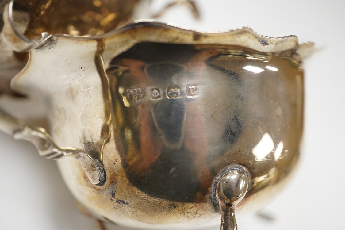 Two George V silver sauceboats, William Hutton & Sons, Birmingham, 1910 and S. Blanckensee & Sons, Birmingham, 1916, both approx. 16cm in length, 7.1oz.